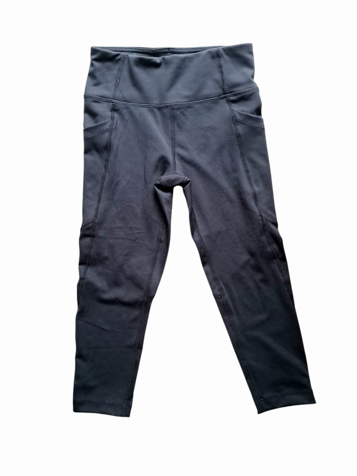 Dúo pack leggings 32° Degrees Active juvenil. Gris y negro, costuras planas, bolsillos laterales. Tela transpirable, elasticidad 4 direcciones. Minicostos RM.