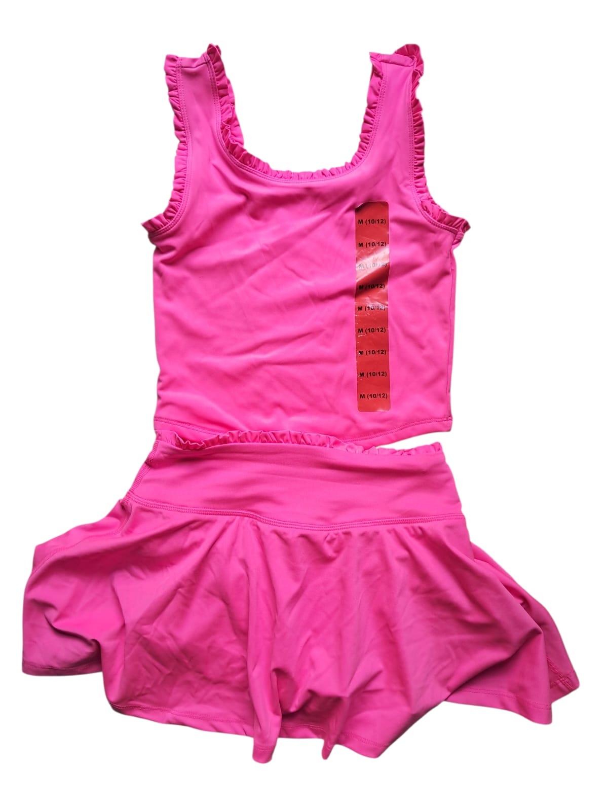 Set 2 piezas 90 Degree by Reflex Kids. Falda con short integrado (skort) y top deportivo. Poliéster y elastano de secado rápido. Talles CH, M, G. Minicostos RM.