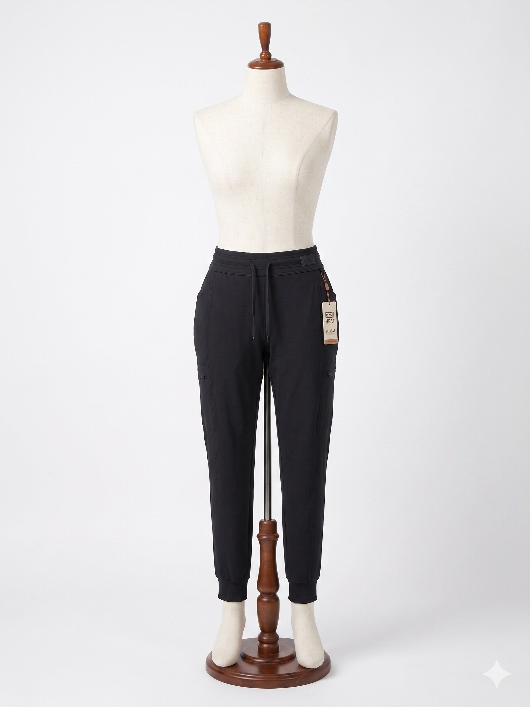Pantalón deportivo 32 Degrees Heat para mujer. Tecnología REHEAT, cinturilla ajustable. Negro, talla XL. Ideal para invierno o actividades al aire libre. Minicostos RM.